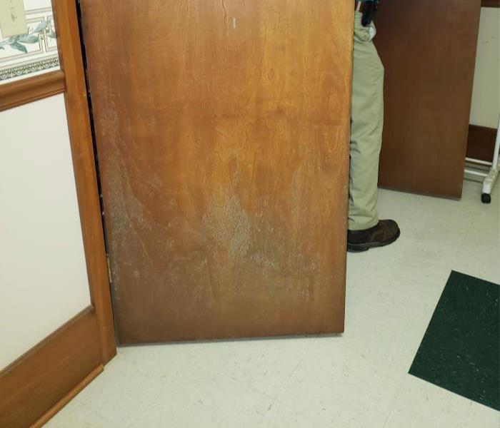 A door in city hall building with mold on it's surface